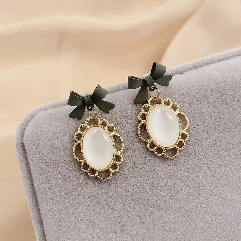 83 oval cats eye bow earrings-333